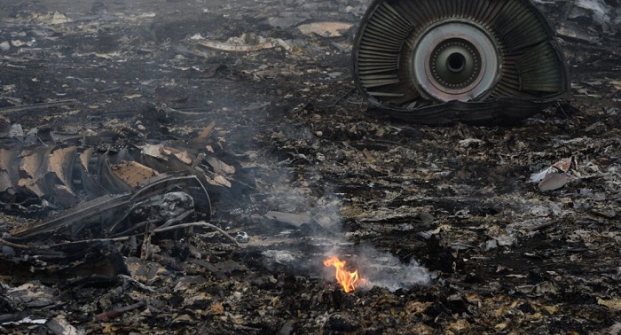 Bone fragment of MH17 passenger among items seized from Dutch journalist 